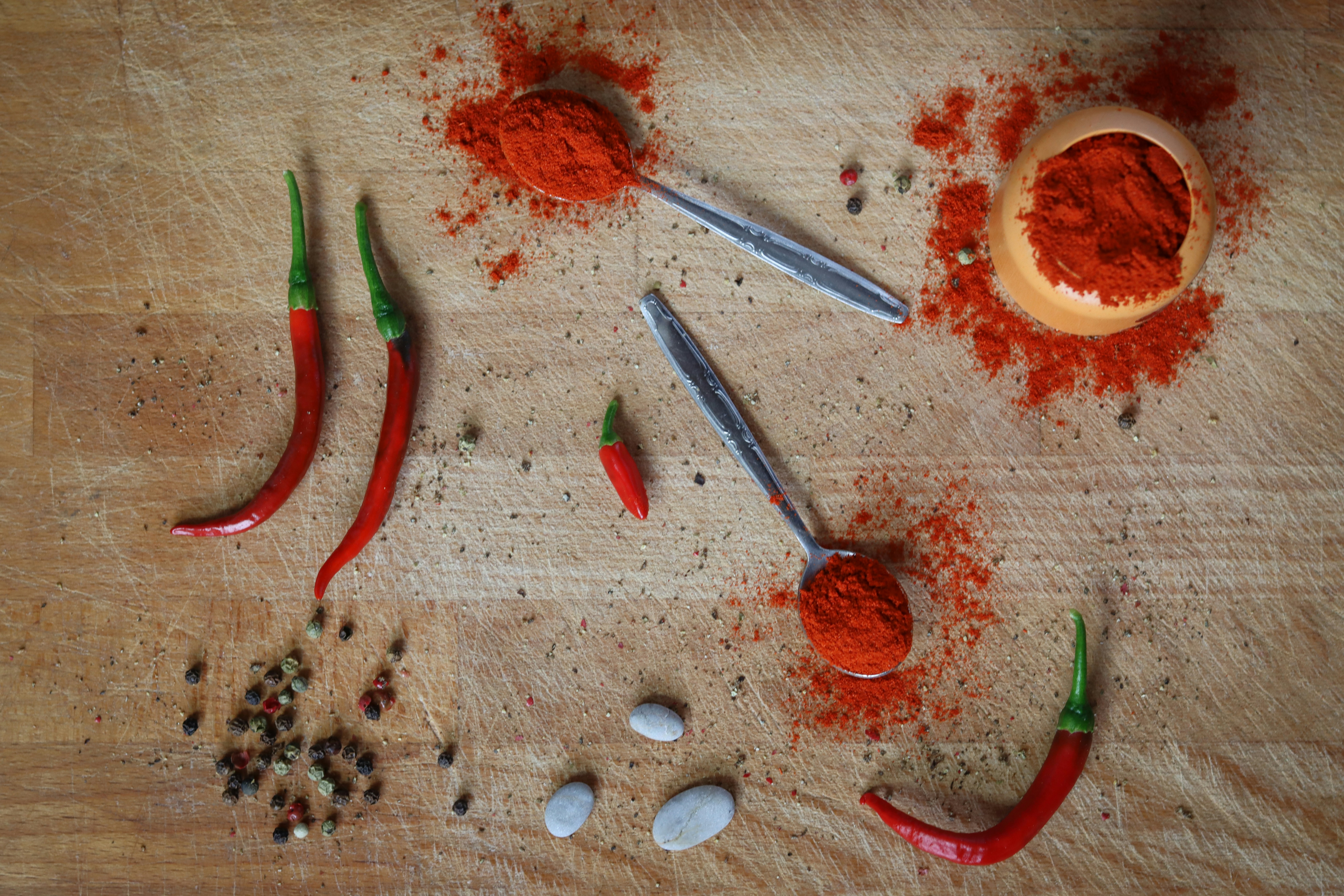 Photo of chilis and chili powder by Malinovy Knedlik on Unsplash